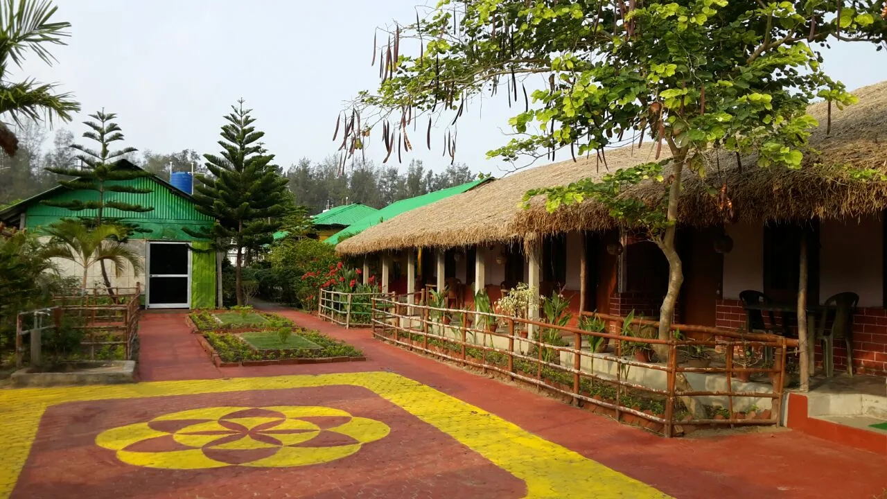 Resort courtyard with terracotta floor and yellow mandala design
